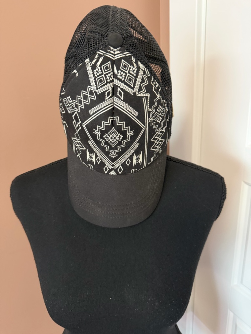 Billabong Black Mesh Trucker Hat with White Geometric Print.